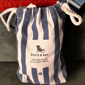 Blue and White Striped Drawstring Bag with a large towel